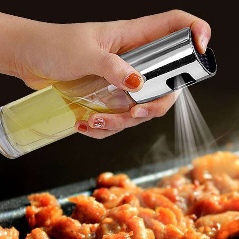 Dual function oil dispenser pouring oil into pan