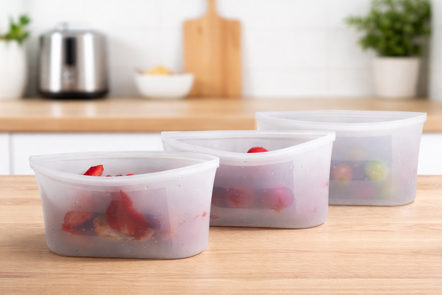 Reusable BPA-free silicone storage bags keeping fruits fresh in a modern kitchen